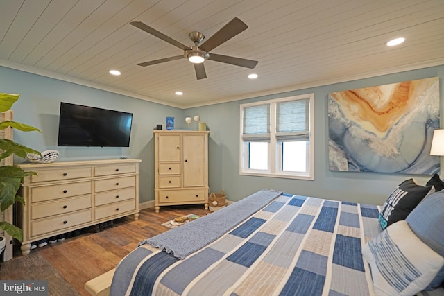 bedroom featuring dark wood-type flooring, wood ceiling, ornamental molding, and ceiling fan