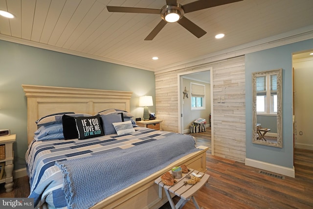 bedroom with wood ceiling, crown molding, and dark hardwood / wood-style floors