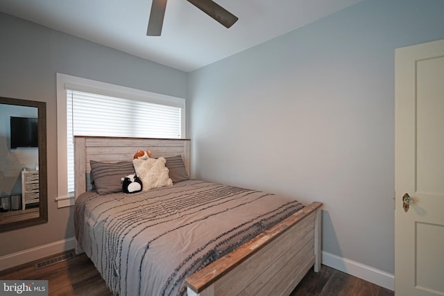 bedroom featuring dark wood-type flooring and ceiling fan