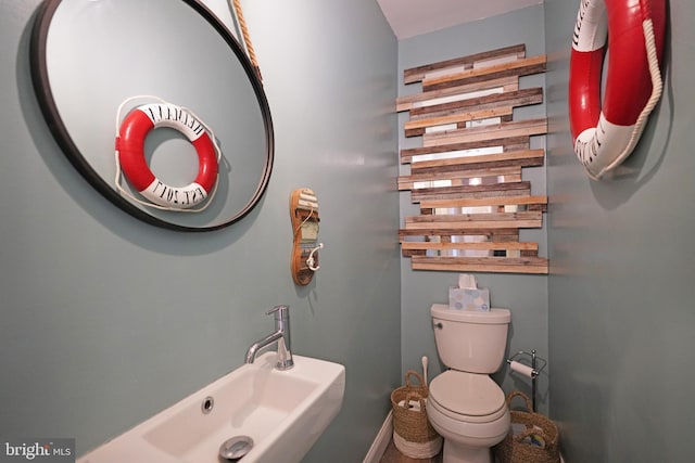 bathroom featuring sink and toilet