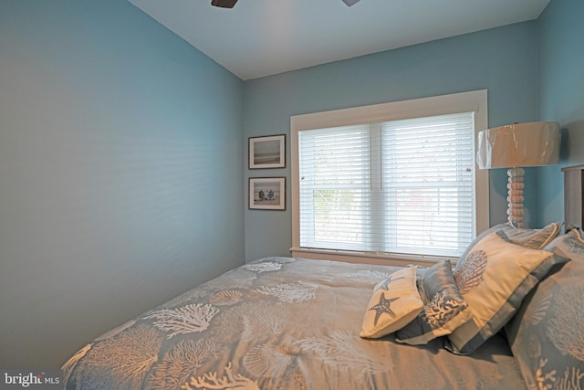 bedroom with lofted ceiling and ceiling fan