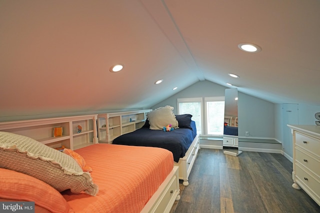 bedroom with vaulted ceiling and dark hardwood / wood-style floors