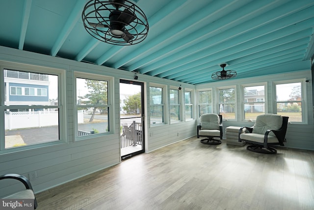 sunroom with lofted ceiling with beams