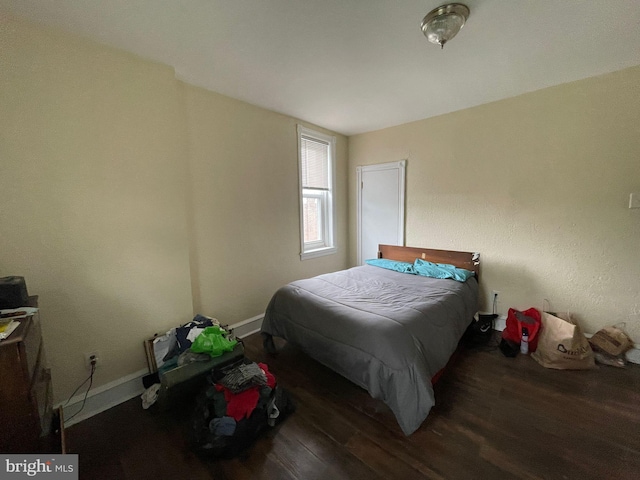 bedroom featuring dark wood-type flooring