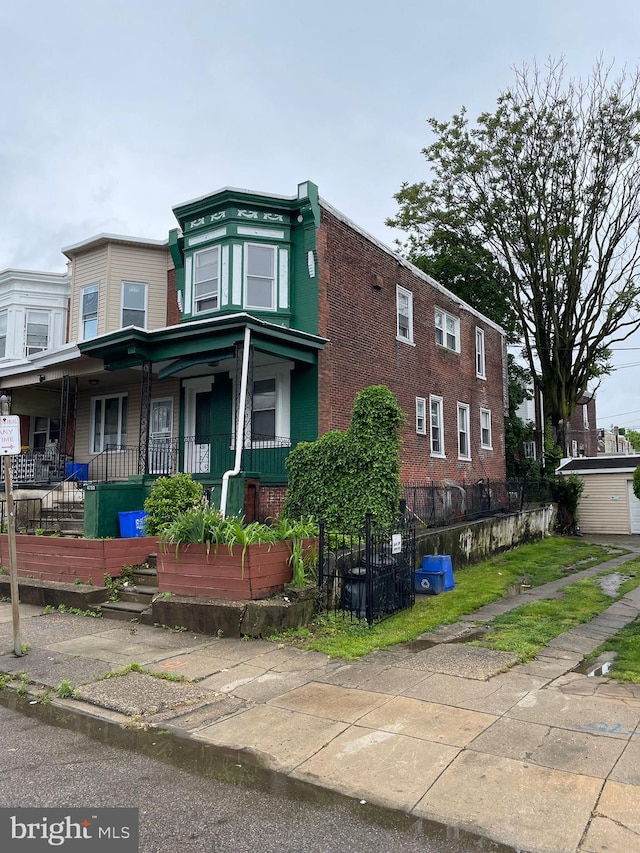 view of side of home featuring a porch