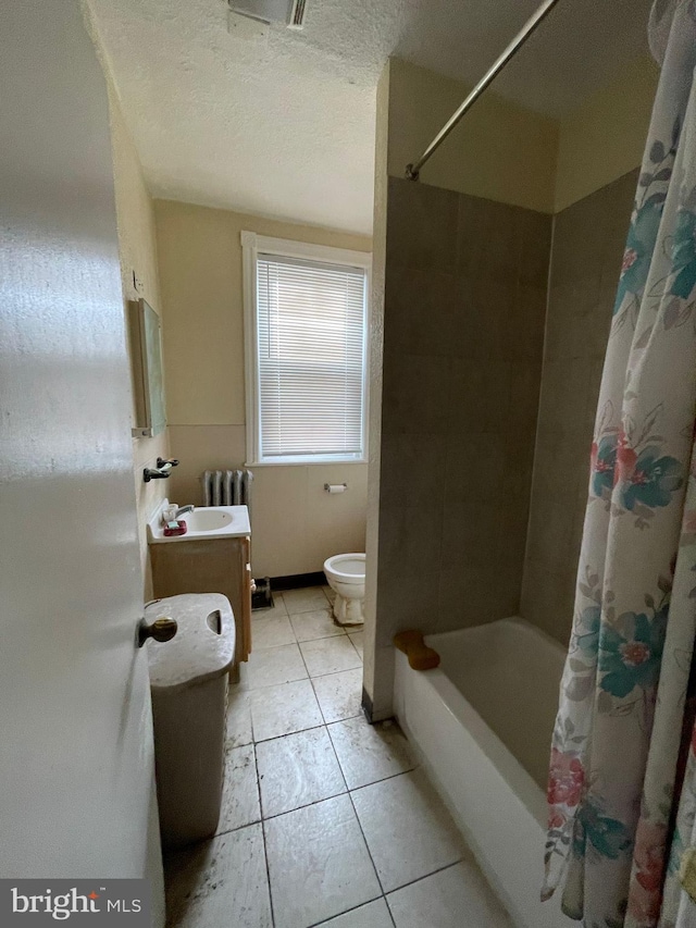 full bathroom featuring tile patterned flooring, a textured ceiling, toilet, vanity, and shower / tub combo