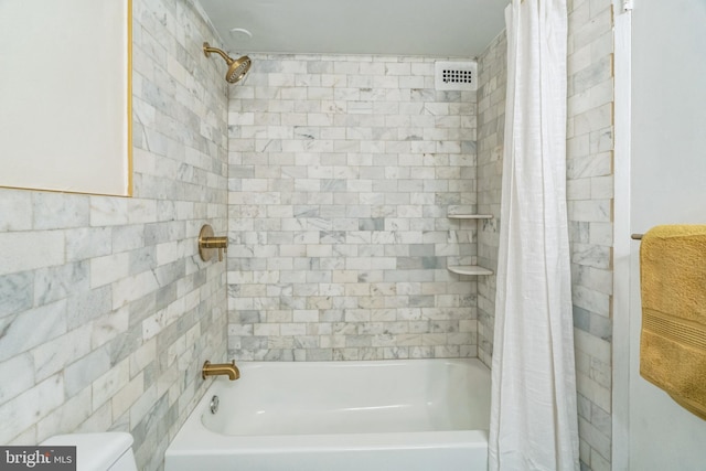 bathroom featuring shower / tub combo