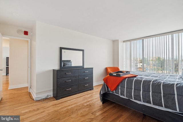 bedroom with wood-type flooring