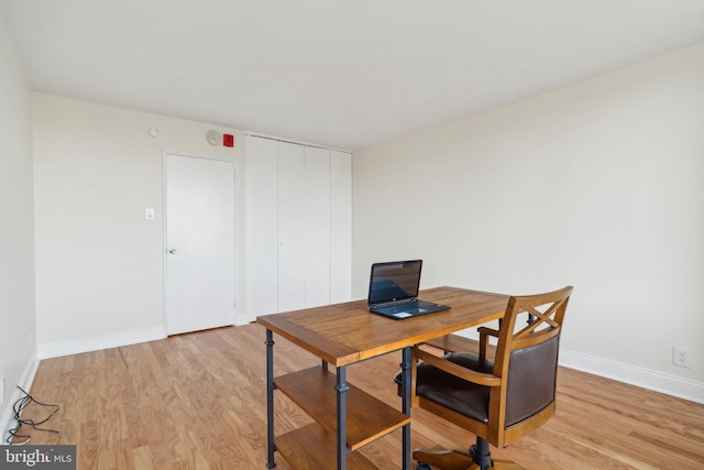 office with light wood-type flooring