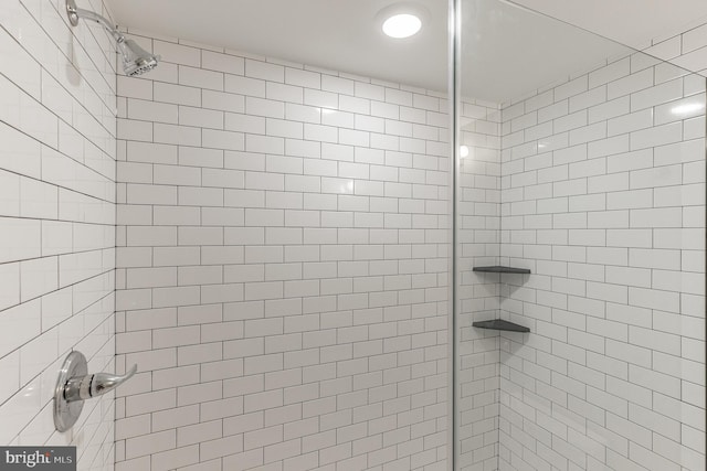 bathroom with a tile shower