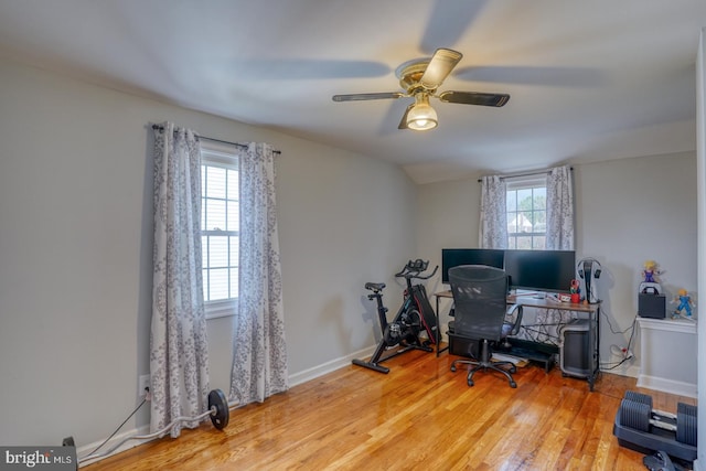 office with ceiling fan, plenty of natural light, lofted ceiling, and light hardwood / wood-style flooring