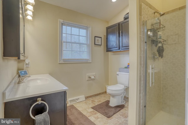 bathroom with vanity, tile patterned floors, vaulted ceiling, toilet, and walk in shower