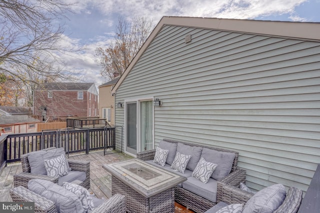 wooden terrace featuring outdoor lounge area