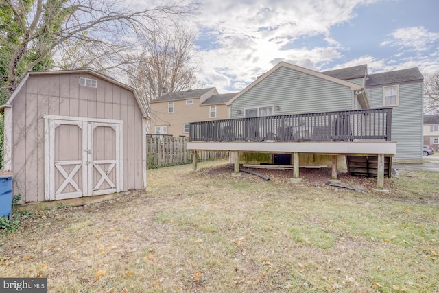 view of yard with a storage unit and a deck