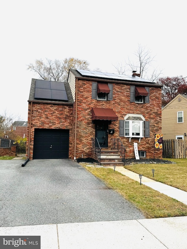 view of front of home featuring solar panels