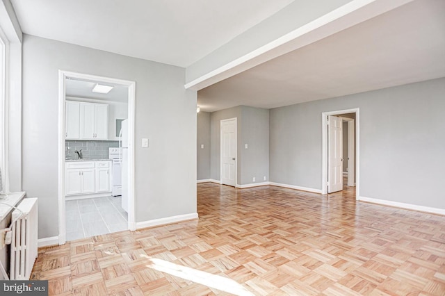 interior space featuring light parquet floors and sink