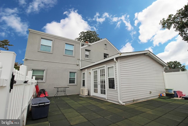 rear view of house featuring a patio and french doors