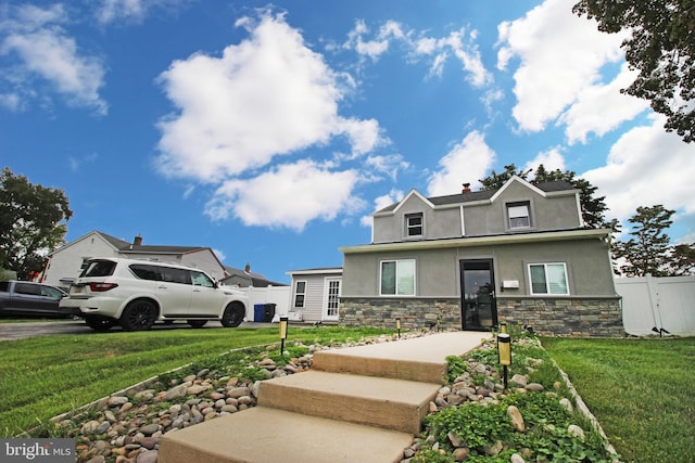 view of front facade with a front yard