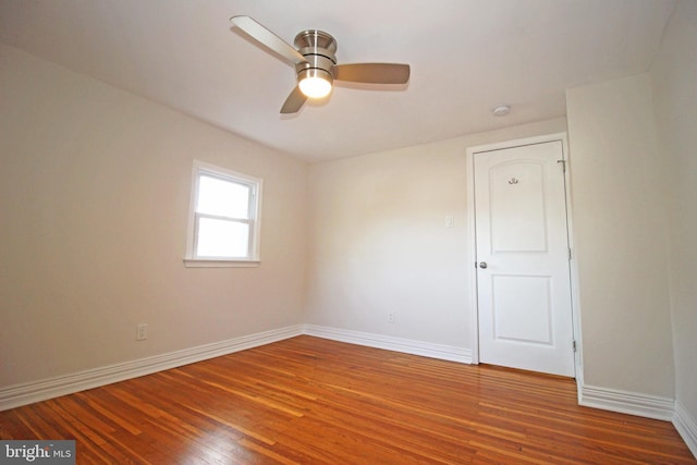 unfurnished room featuring hardwood / wood-style floors and ceiling fan