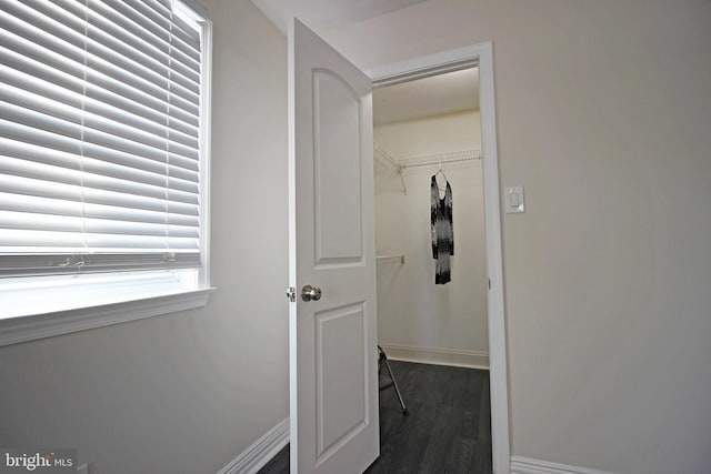 hall with dark wood-type flooring