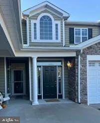 view of exterior entry featuring a garage