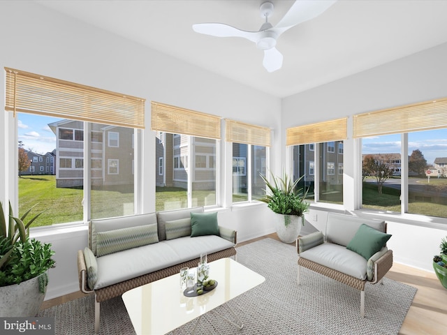 sunroom featuring ceiling fan and a healthy amount of sunlight