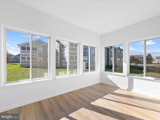 unfurnished sunroom featuring plenty of natural light