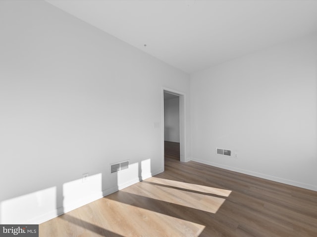 spare room featuring hardwood / wood-style floors