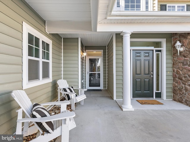 doorway to property with covered porch