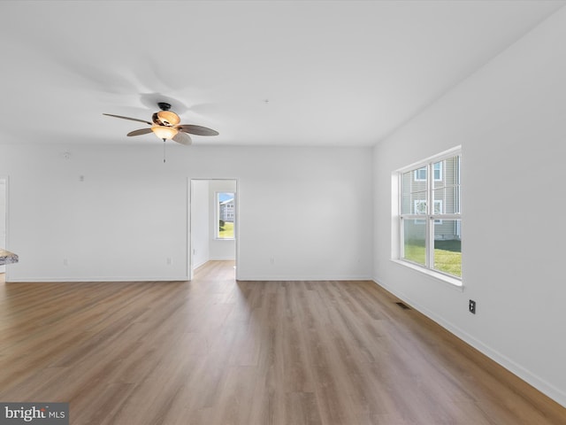 unfurnished room with light hardwood / wood-style floors and ceiling fan