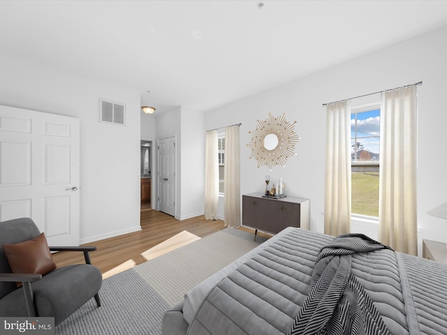 bedroom with light hardwood / wood-style flooring