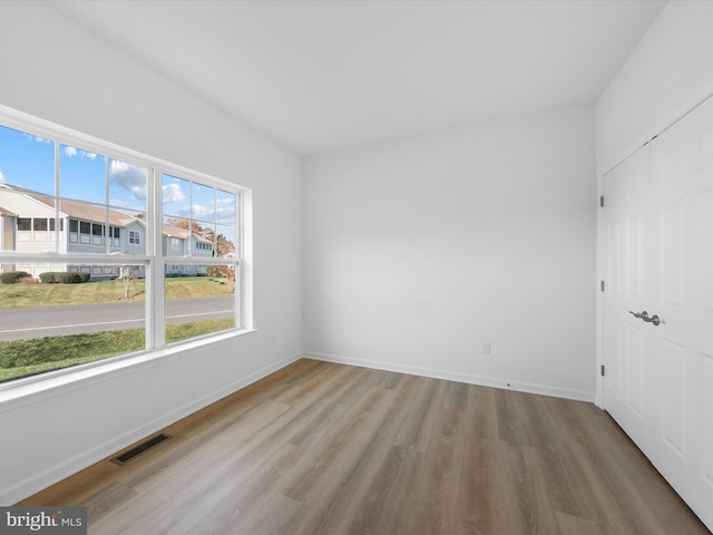 spare room featuring light hardwood / wood-style flooring