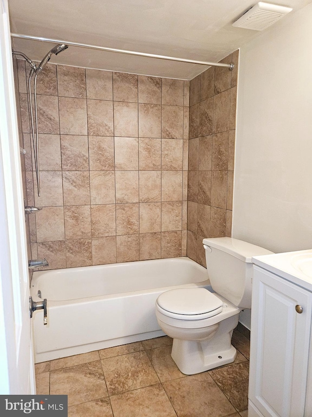 full bathroom featuring vanity, toilet, and tiled shower / bath