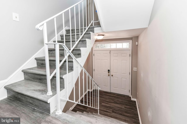 stairway featuring wood-type flooring