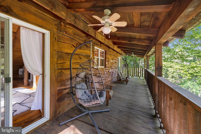 wooden deck with ceiling fan and a porch