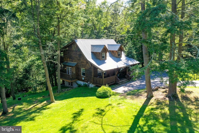 exterior space with a front yard and a porch