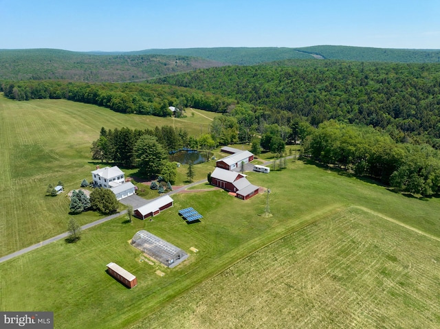 birds eye view of property with a rural view