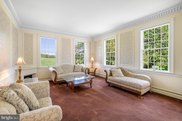 sunroom with a wealth of natural light and a baseboard heating unit