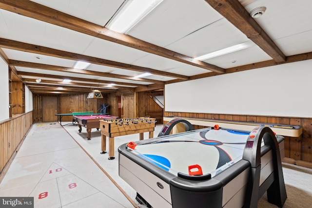 game room featuring beam ceiling, billiards, and wood walls