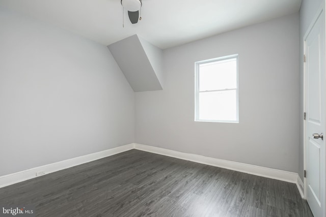 additional living space with ceiling fan and dark hardwood / wood-style flooring