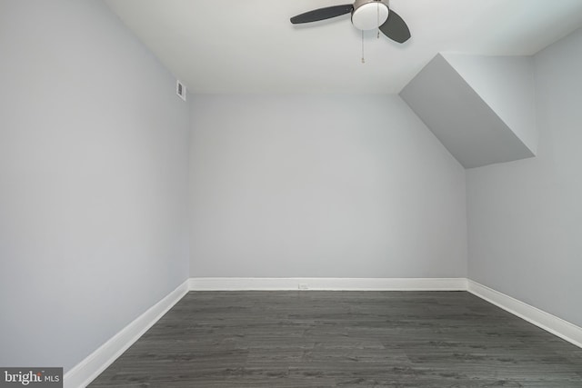 bonus room with dark hardwood / wood-style floors, ceiling fan, and vaulted ceiling