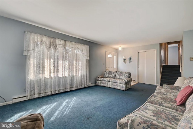 carpeted living room featuring a baseboard heating unit