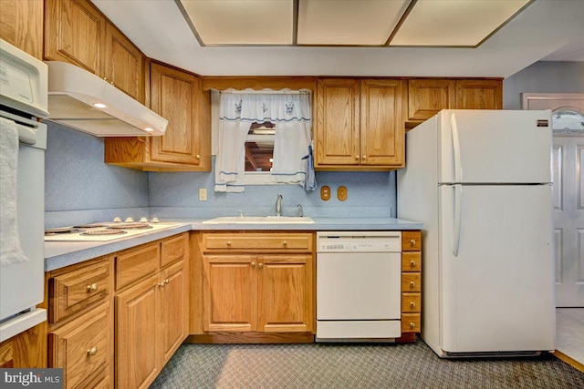 kitchen with sink and white appliances