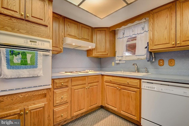 kitchen featuring sink and white appliances