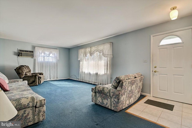 living room with an AC wall unit and light colored carpet