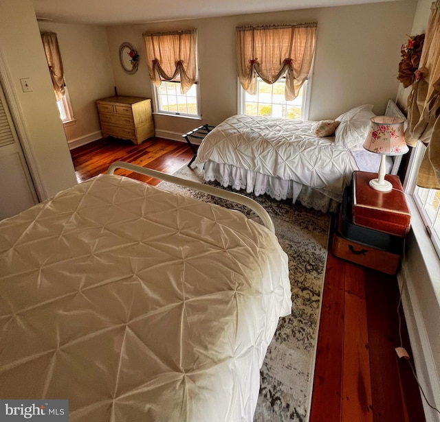 bedroom with wood-type flooring