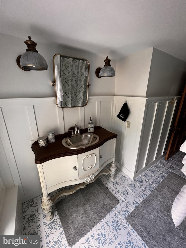 bathroom with tile patterned floors and vanity