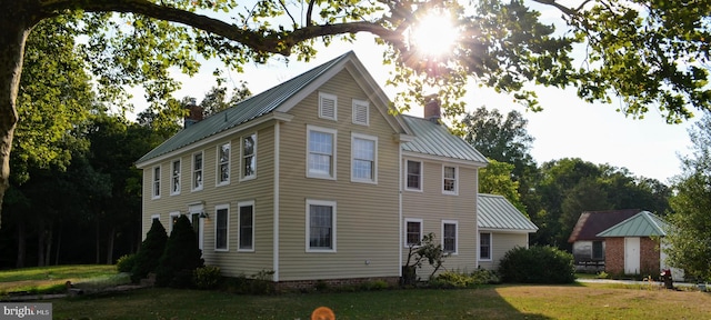 view of home's exterior with a yard