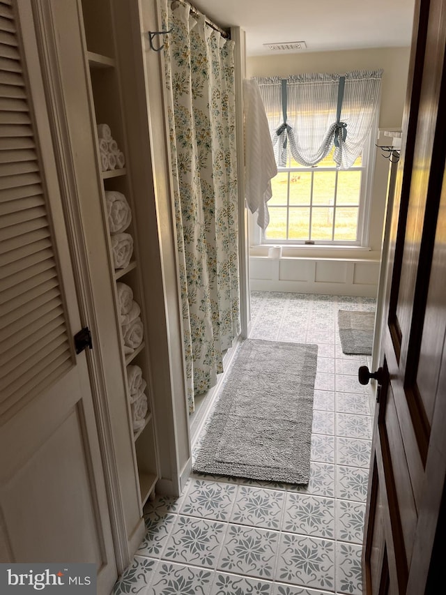 bathroom featuring tile patterned flooring