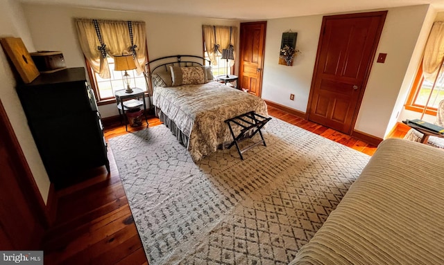 bedroom featuring dark hardwood / wood-style flooring